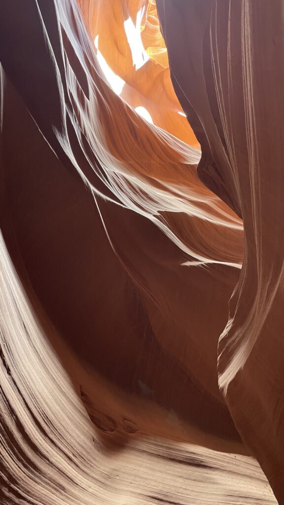 Curving red sandstone walls inside Upper Antelope Canyon in Arizona.
