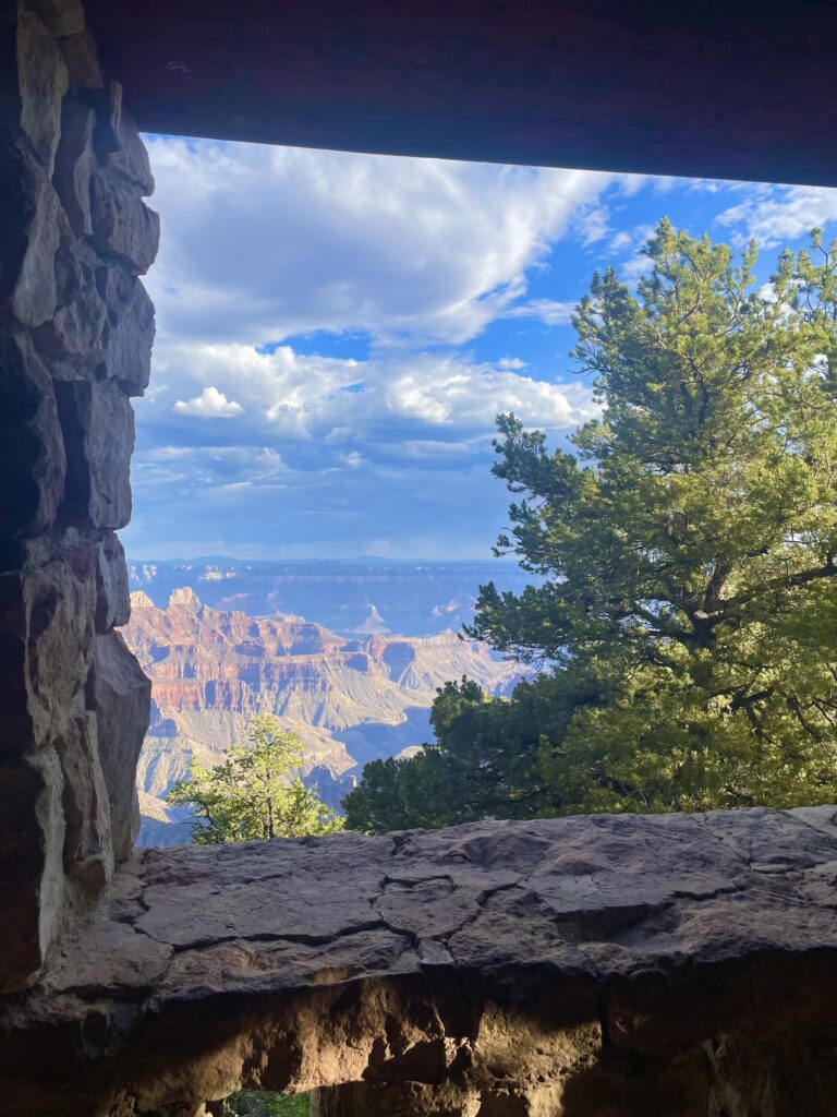 Grand Canyon North Rim view framed by a stone window in Arizona.