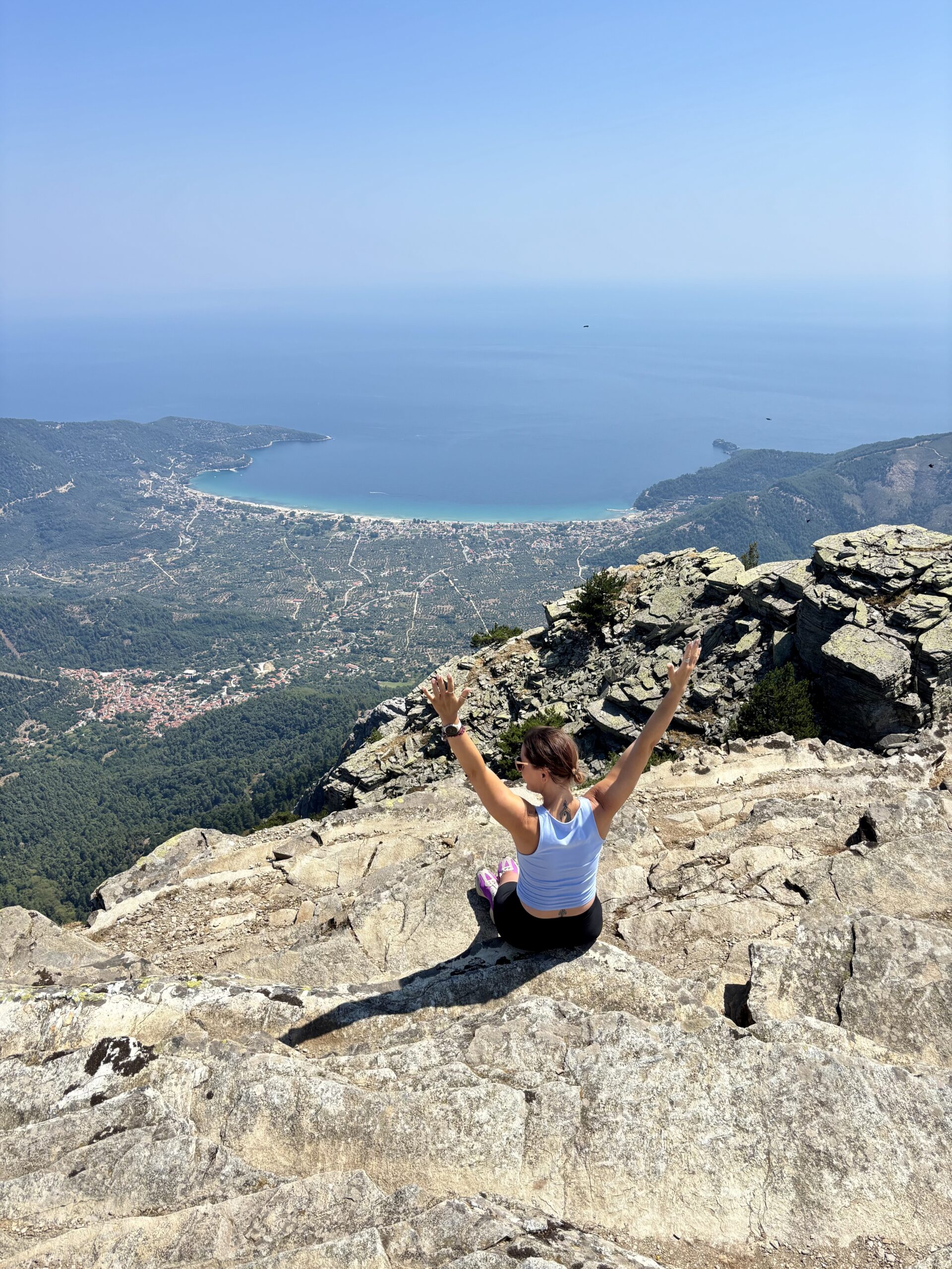 Woman enjoying the view from Mount Ipsarion on Thassos, Greece.