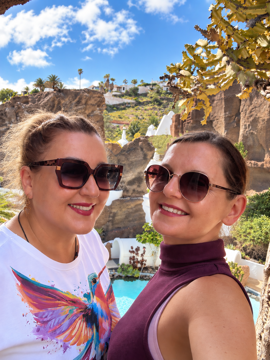Two friends smiling together while travelling in Lanzarote, Canary Islands.
